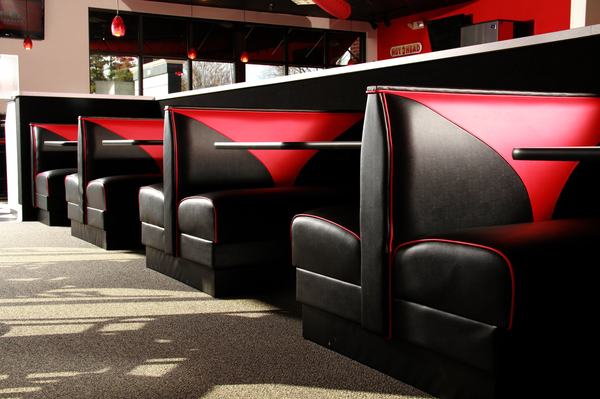 detailed-view-of-red-and-black-restaurant-seating-booth
