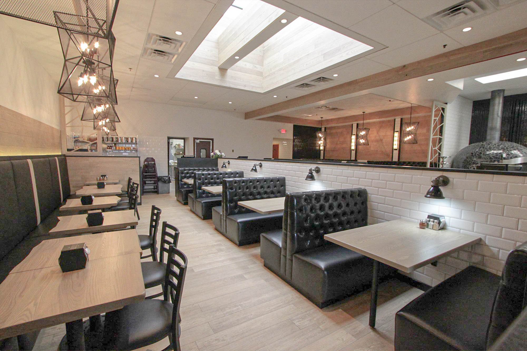 aerial-view-of-restaurant-dining-area-interior-organized-row-of-black-tufted-booth-seating