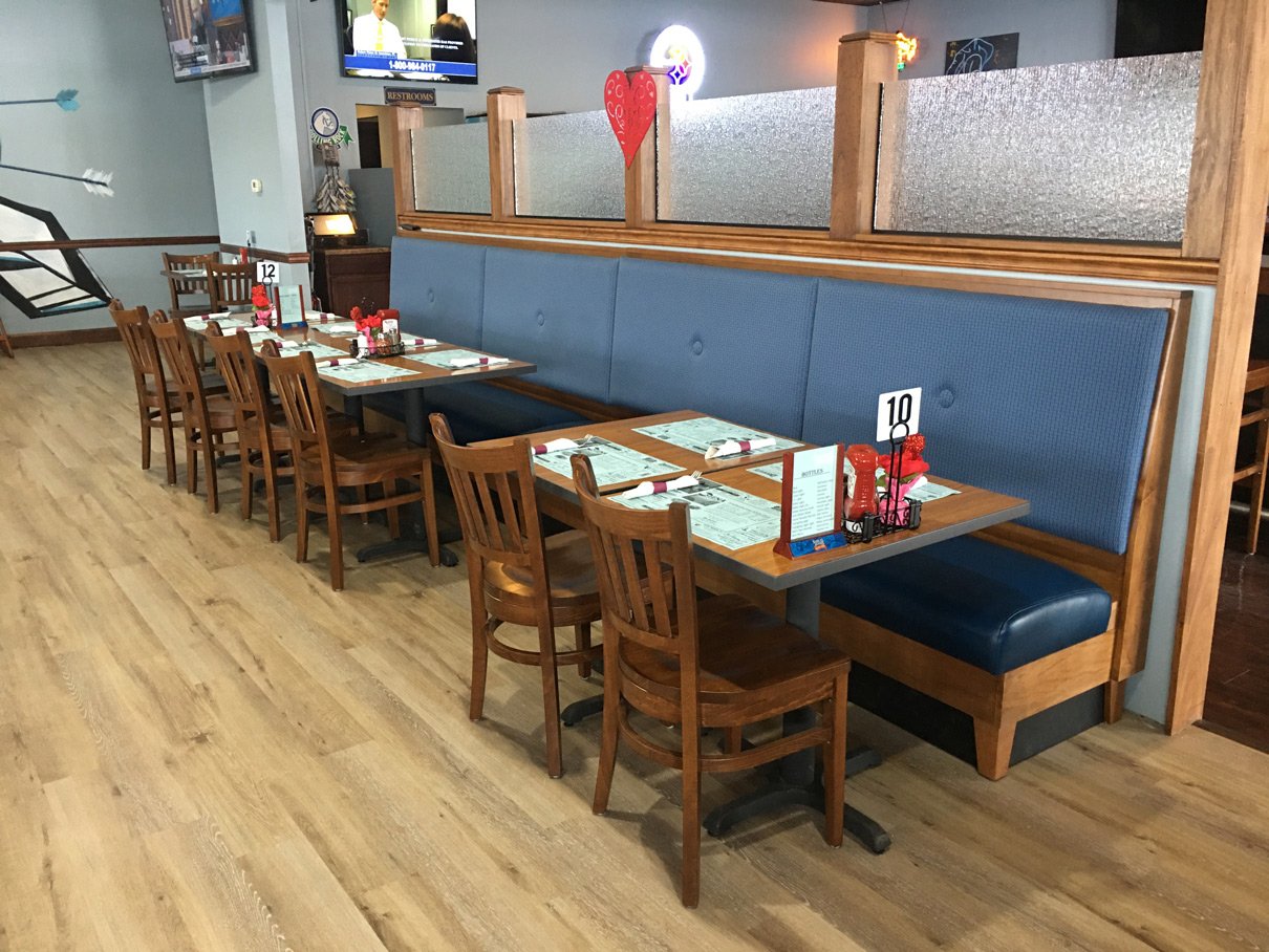 Hermitage-PA-restaurant-interior-elongated-booth-with-line-of-tables-and-facing-chairs