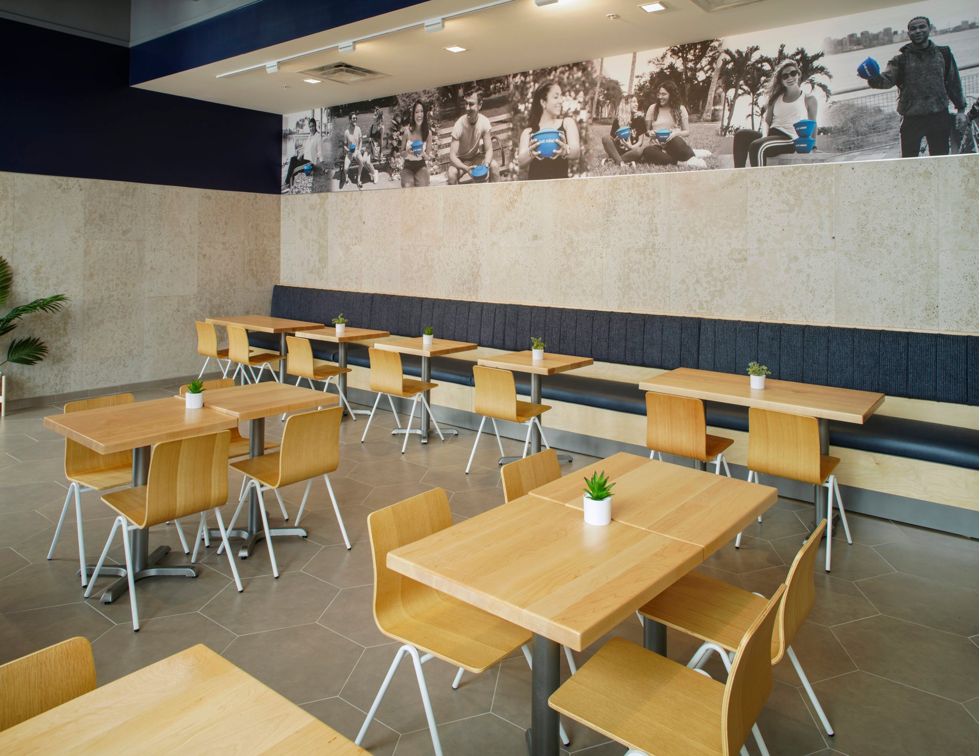 Northlake-FL-aerial-view-of-restaurant-interior-with-wood-rectangle-tables-centered-around-simple-wood-chairs