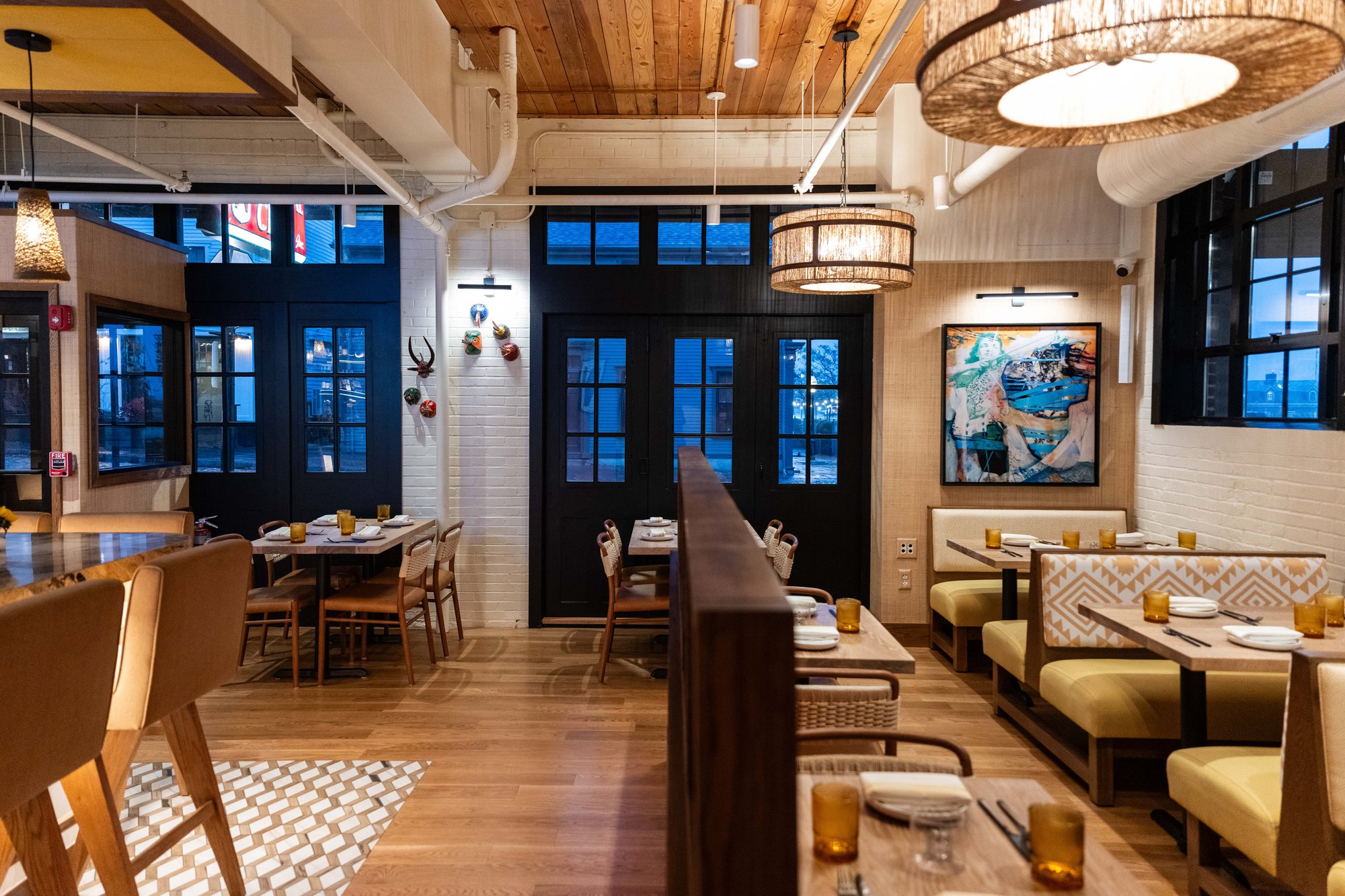 Modern-Mexican-Restaurant-with-barstools-booths-wooden tables-chairs